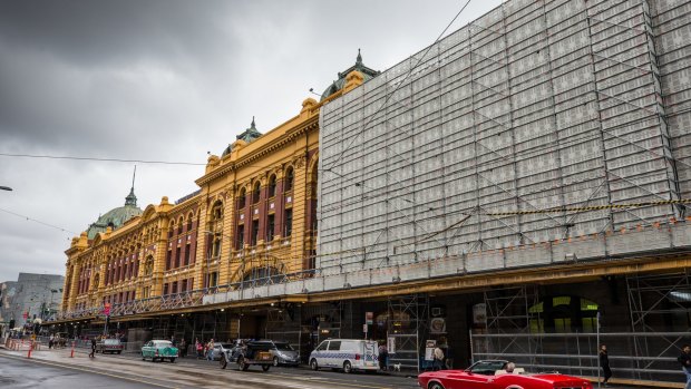 The ugly building hoarding at Flinders Street Station will not be changed under council's proposal.