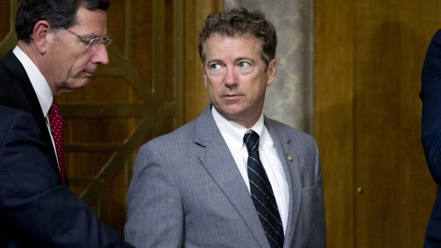 Republican presidential candidate and Senate foreign relations committee member Rand Paul leaves the meeting on Iran.