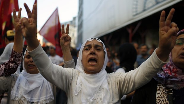 Protesters chant slogans in Istanbul after the attack.