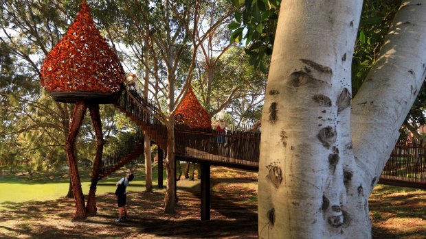The treehouses appear to be wandering across the park in this artist's impression.