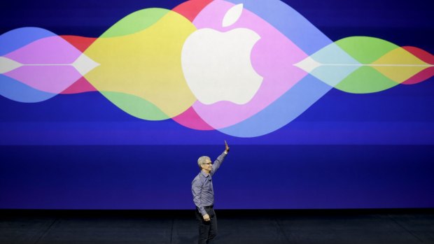 Apple chief executive Tim Cook takes the stage at the Bill Graham Civic Auditorium in San Francisco on Wednesday.