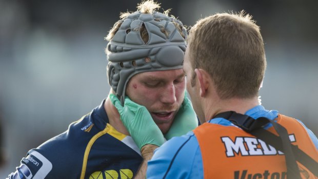 ACT Brumbies star David Pocock was concussed playing final game in Japan before returning to Canberra.