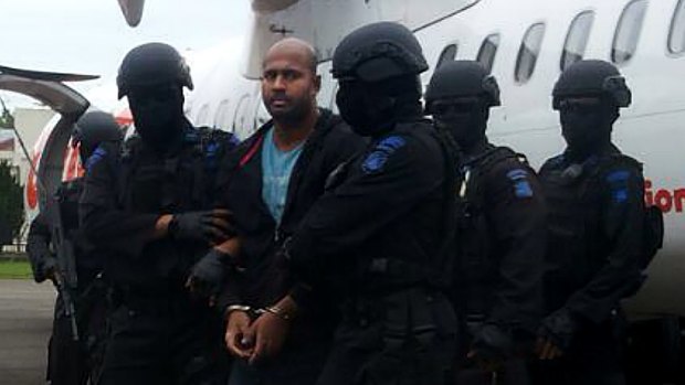 Myuran Sukumaran handcuffed arriving at Cilacap airport.