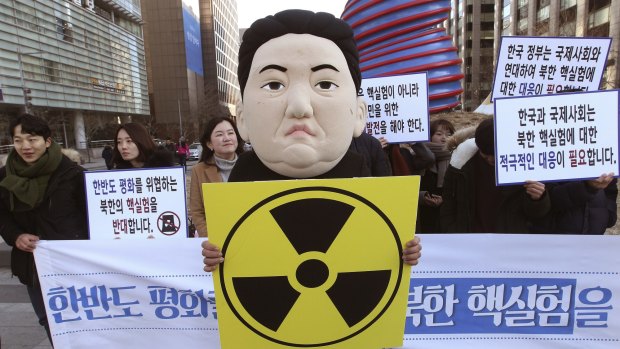 A South Korean student wearing a mask depicting North Korean leader Kim Jong Un at a rally in Seoul.