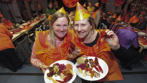 IKEA fans are treated to a traditional lobster party ahead of the store's official opening later this year. Virginia Yabsley (left) and Chedal Baesjou, both of Harrison, tuck in.