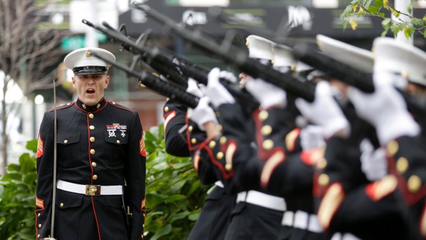 Marines perform a 21 gun salute before the start of the annual Veteran's Day parade in New York, Wednesday, November 11, 2015. 
