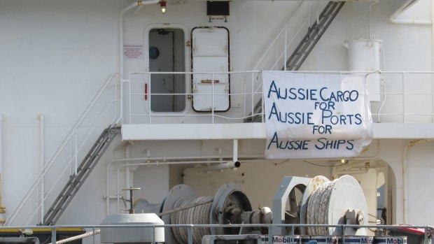 A protest sign on the MV Portland, whose Australian crew was recently dumped for a cheaper alternative.