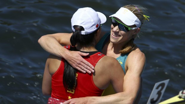 Australian gold medalist Kim Brennan and Bronze medalist Duan Jingli of China embrace after their final at Rio's Lagoa Stadium on Saturday.
