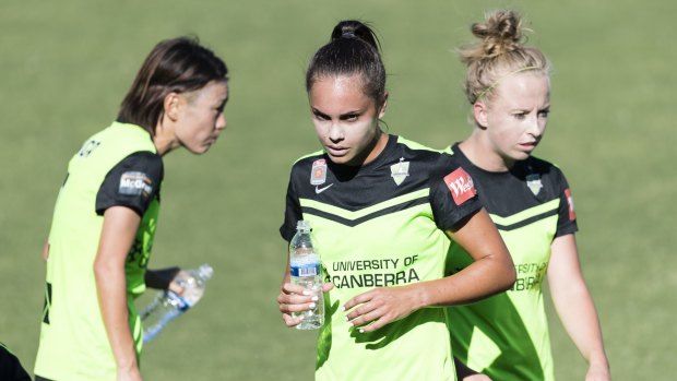 Australian and Canberra United defender Emma Checker [middle] can't tale a trick after another injury setback.