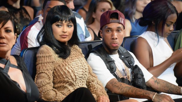 Kylie Jenner and Tyga sit next to Kylie's mother Kris at the 2015 MTV Video Music Awards on August 30, 2015 in Los Angeles, California. 