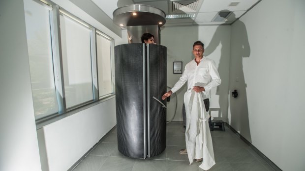 Cryospa owner David McPhan shuts journalist Emily Baker in the cryotherapy machine.