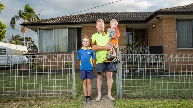 David Inverarity and sons Nathan, 8, and baby Luke. Mr Inverarity doesn't want a pub built close to his son's Casula school.