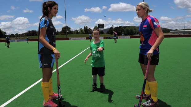 Canberra's Hockeyroos players Anna Flanagan, left, and Edwina Bone, return for the Strikers in this year's Australian Hockey League.