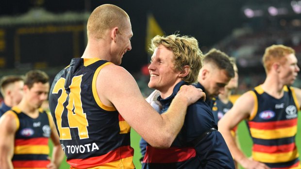 Rory Sloane (right) with teammate Sam Jacobs after the Crows beat the Giants in their qualifying final.