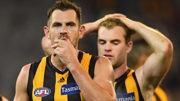 Luke Hodge says the mindset of the Hawks after their 2013 premiership differed significantly from that after they won in 2008.