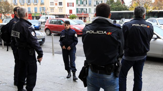 French and Spanish police officers patrol the station of Bayonne, south-western France, on Friday. The country remains on high alert for possible terrorist attacks.