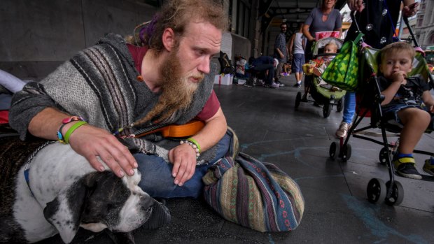 Glen, 32, with his dog, Tonka, at the Flinders Street Station camp.