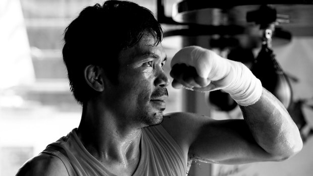 Manny Pacquiao's trainer says the boxer's timing is "off".