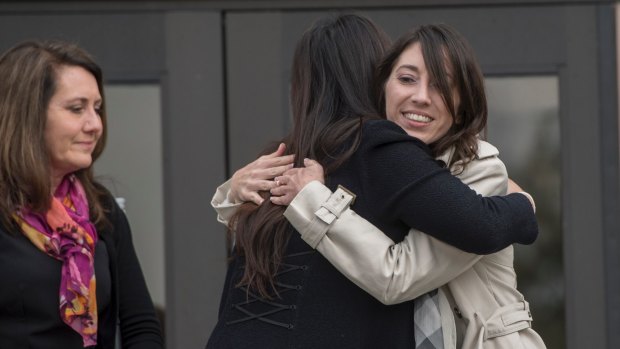 Michelle Hadley, right, hugs Orange County District Attorney Chief of Staff Susan Kang Schroeder after being cleared of all charges on Monday.