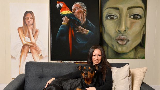 Irene Vides pictured with her portrait of John Singleton, which she will enter in this year's Archibald Prize.