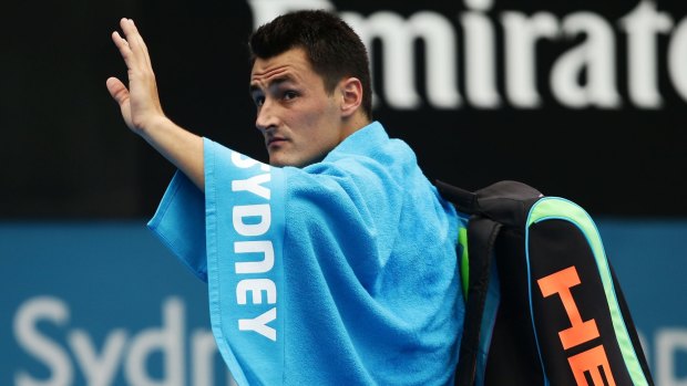 Farewell: Bernard Tomic waves to the crowd at Sydney Olympic Park Tennis Centre after withdrawing from his quarter-final.