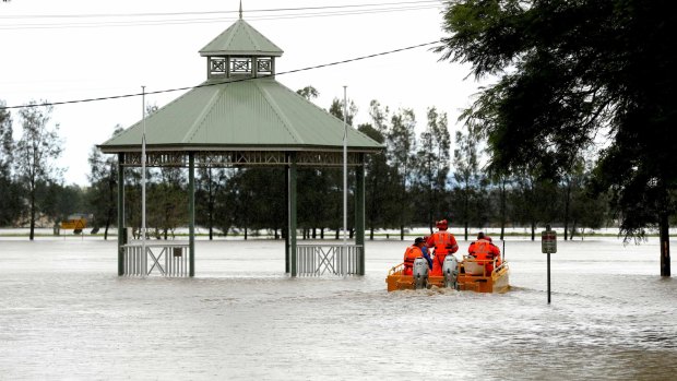 State Emergency Service crew set off in a flood boat to help residents in Raymond Terrace.