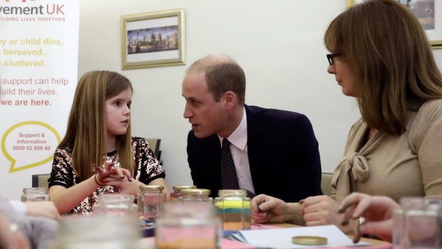 Prince William, Duke of Cambridge speaks to Aoife, 9, during his visit to a Child Bereavement UK Centre in Stratford on January 11, 2017 in London, England.