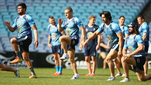 Almost crunch time: Andrew Fifita, Robbie Farah, James Tamou and Aaron Woods warm up during the Blues training session at ANZ Stadium on Tuesday.