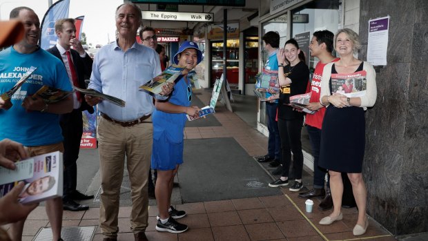 Running the gauntlet: John Alexander and Kristina Keneally hand out how-to-vote cards at Epping station on Friday.