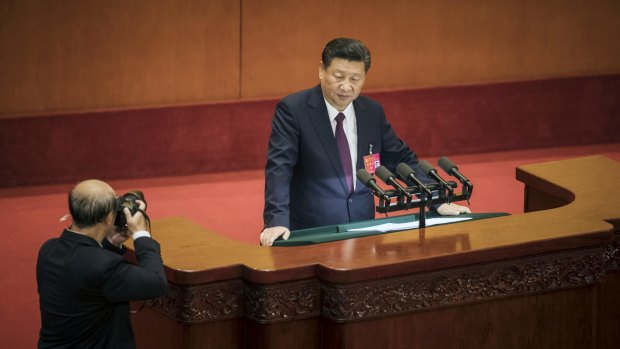 A photographer captures President Xi Jinping during his speech on Wednesday.