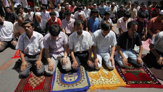 Uighur men pray in a mosque in Urumqi, the capital of western China's Xinjiang province. 