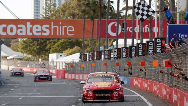 Front runners: Scott McLaughlin and Alex Premat of DJR Team Penske take the chequered flag in the Vodafone Gold Coast 600 on Surfers Paradise street circuit.