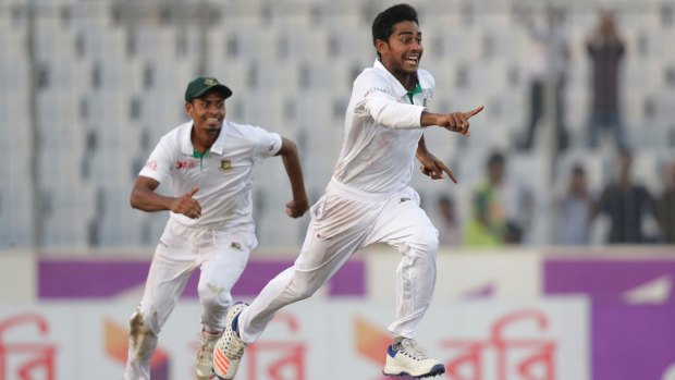 Stunning success: Bangladesh's Mehedi Hasan Miraz, right, and teammate Taijul Islam celebrate a first-ever Test victory over England.