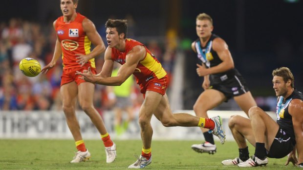 Jaeger O'Meara in action at Metricon Stadium in 2013.