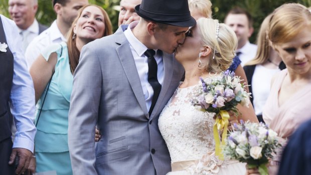 Catherine Lea included a yellow ribbon in her bouquet when she married Robert McArdle at Galston this afternoon.