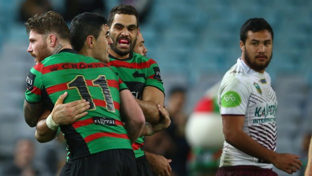 Correct call: Chris McQueen, Bryson Goodwin and Greg Inglis celebrate Goodwin's try on Friday night.