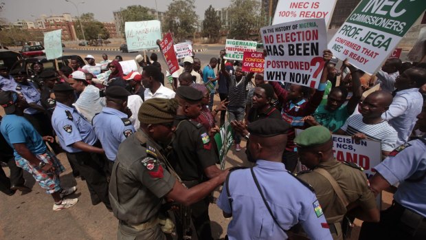 Protesters in Abuja demonstrate against the delay of the scheduled February 14 elections. 
