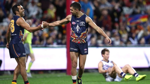 Crows duo Charlie Cameron and Eddie Betts celebrate a goal.
