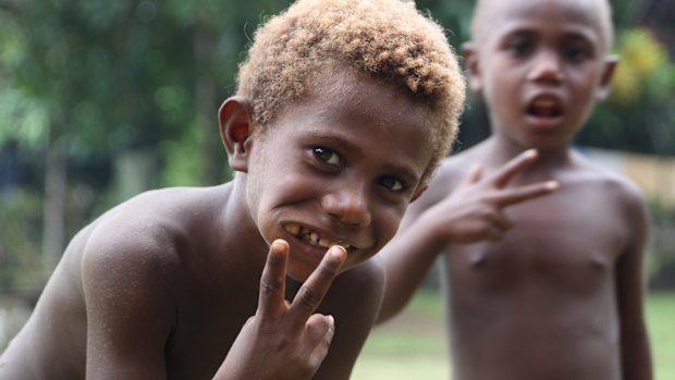 Kids chewing betel nut in Maira.