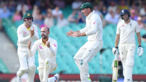 Tweaked: Nathan Lyon celebrates after taking the wicket of England opener Alastair Cook with a fizzing off-break.