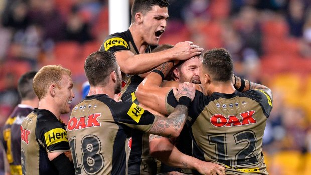 "To be honest, it's the most I've loved footy for a long time.": Trent Merrin celebrates a try with his Penrith teammates.