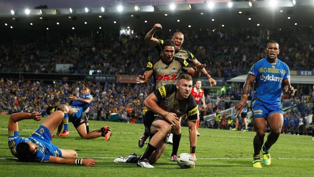 Bryce Cartwright of the Panthers scores the winning try during the round five NRL match between the Parramatta Eels and the Penrith Panthers.