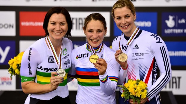 Kristina Vogel of Germany (centre) celebrates winning a gold medal in the keirin, with Australian Anna Meares (left)  taking second and Britain's Rebecca third.