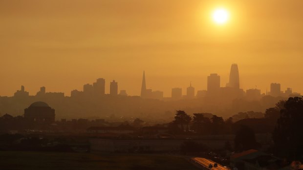 Smoke and haze from the fires hover over the San Francisco skyline on Thursday.