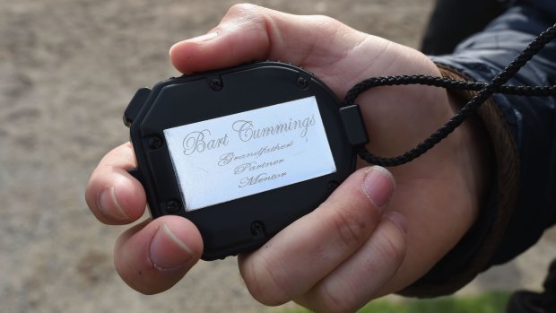 Bart time: Trainer James Cummings holding Bart Cummings' famous stop watch at Flemington on Thursday morning.