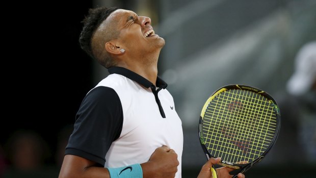 Nick Kyrgios celebrates victory over Roger Federer in Madrid earlier this month