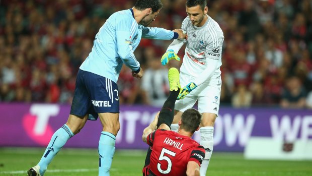 Famous derby moments: Sasa Ognenovski stops Sydney FC keeper Vedran Janjetovic from helping injured Wanderer Brendan Hamill.