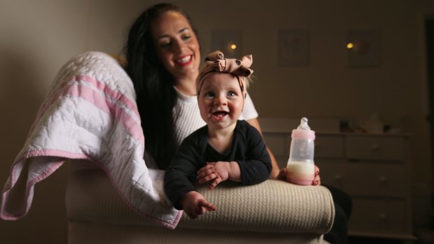 Tara Lloyd feeds her 8-month-old daughter Gracie Perkin a2 Platinum infant formula.