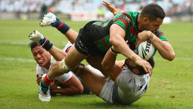 Too strong: Greg Inglis crosses for the Rabbitohs in round 3.