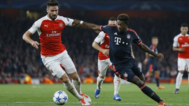 Arsenal's Olivier Giroud, left, and Bayern's David Alaba in the 2-0 Champions League match at Emirates.